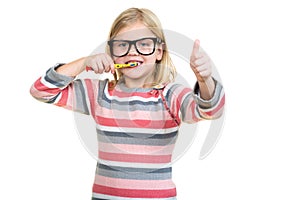 Little girl brushing her teeth isolated on white background