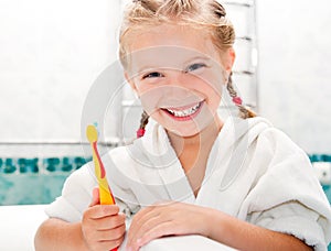 Little girl brushing teeth