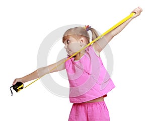 Little girl with a building tape measure.