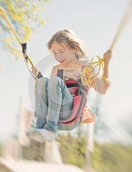 Little girl on bungee.