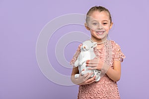 Little girl with bunny statuette for Easter