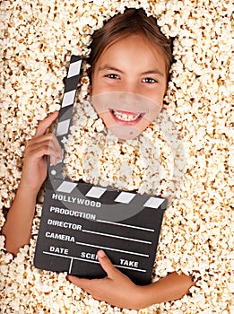 Little girl buried in popcorn