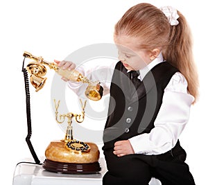 Little girl in business suit call telephone.