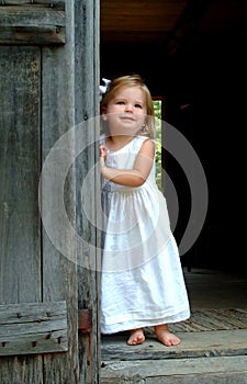 Little Girl in Cabin Doorway