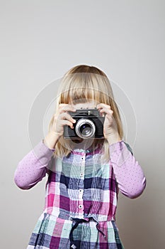 Little girl with camera