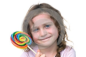 Little girl and candy pin wheel sucker