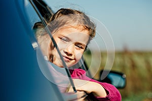 Little girl in a car