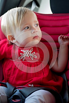 Little girl in car safety seat