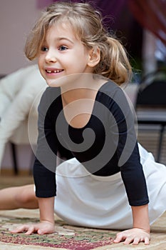 Little girl carries out exercise