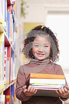 Little Girl Carrying Books