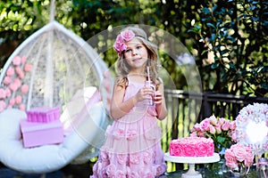 Little girl celebrate Happy Birthday Party with rose outdoor