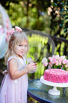 Little girl celebrate Happy Birthday Party with rose outdoor