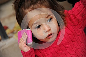 Little girl with a cellphone photo