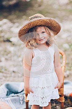 Little girl in a chair outdoors