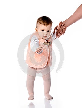 Little girl child just starting to walk first step photo