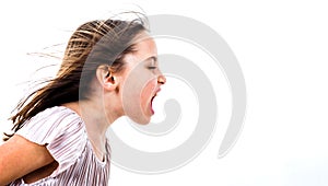 Little girl child yelling, shouting and screaming with bad manners