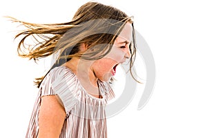 Little girl child yelling, shouting and screaming with bad manners