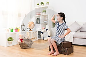 Little girl children sitting on retro suitcase