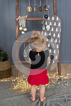 Little girl on Christmas background