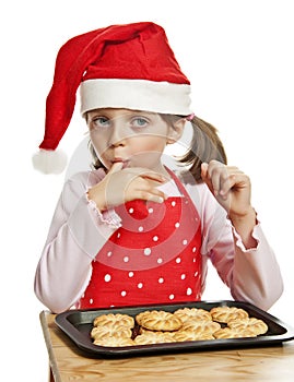 Little girl with Christmas cookies
