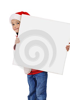 Little girl in Christmas hat with an empty banner