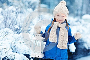 Little girl with Christmas lantern