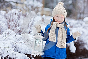 Little girl with Christmas lantern