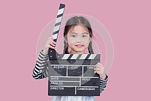 Little girl with a clapperboard