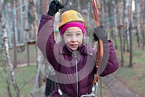 Little girl climber is ready to the passage