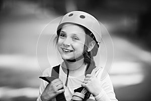 Little girl climbing in adventure activity park with helmet and safety equipment. Little girl climbing on high rope park