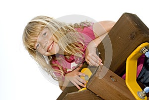 Little girl climbing a playset photo