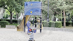 Little girl climbing a slide in the playground