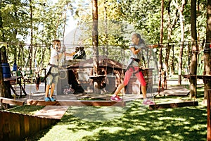 Little girl climbs in rope park