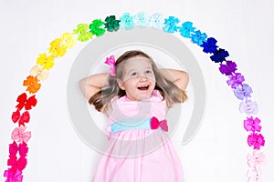 Little girl with colorful bow. Hair accessory