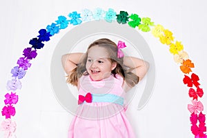 Little girl with colorful bow. Hair accessory