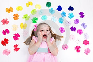 Little girl with colorful bow. Hair accessory