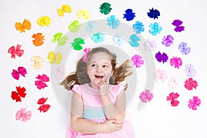 Little girl with colorful bow. Hair accessory