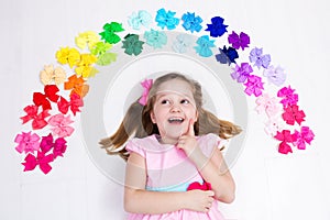 Little girl with colorful bow. Hair accessory