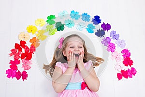 Little girl with colorful bow. Hair accessory