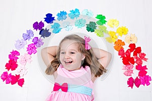 Little girl with colorful bow. Hair accessory