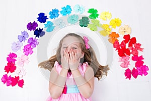 Little girl with colorful bow. Hair accessory