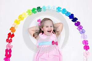 Little girl with colorful bow. Hair accessory