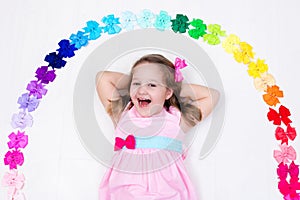 Little girl with colorful bow. Hair accessory