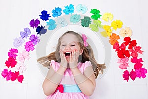 Little girl with colorful bow. Hair accessory