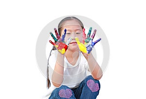 Little girl with colorful hands painted isolated on white background. Focus at child hands