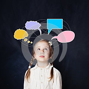 Little girl with colorful speech clouds chalk drawing