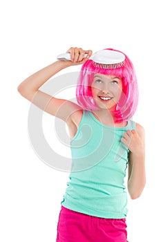 Little girl combing pink hair