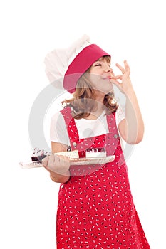 Little girl cook with cakes and ok hand sign