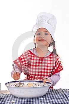 Little girl in the cook costume