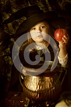 Little girl in with costume with apple